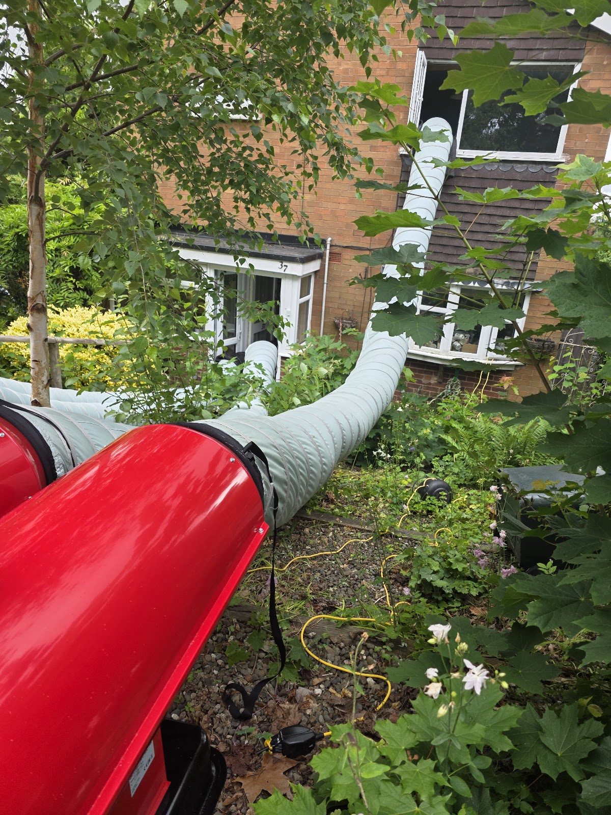 Heat treatment ducting delivering hot air into a house to kill bed bugs